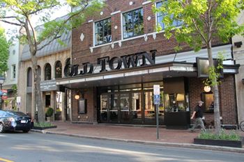 the front of the old town restaurant on a city street